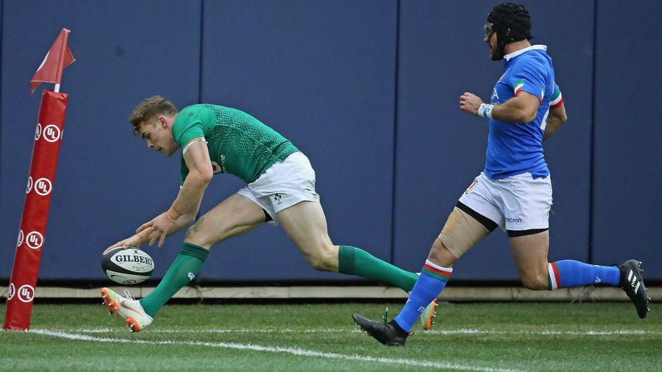 Garry Ringrose of Ireland scores a try in front of Ian Spencer McKinley of Italy