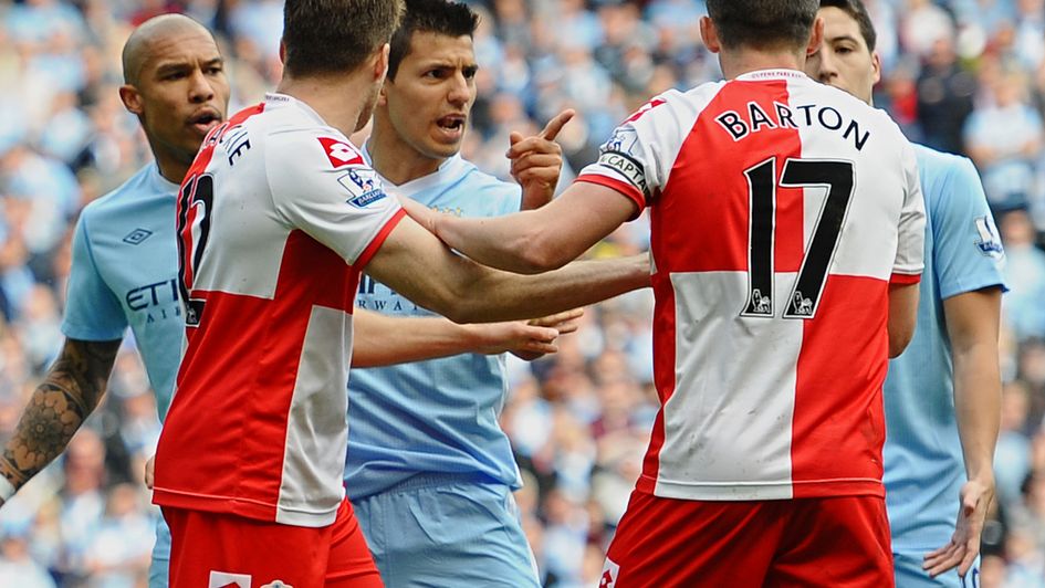 Man City's Sergio Aguero argues with Joey Barton after QPR captain is sent off