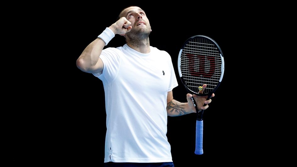 Dan Evans celebrates his victory