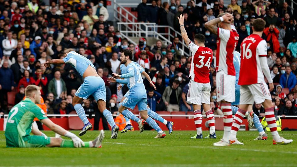 Rodri wheels away to celebrate Manchester City's winner at Arsenal
