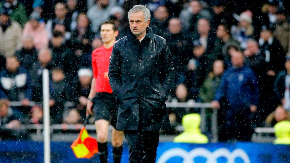 Jose Mourinho watches on during a very wet Boxing Day