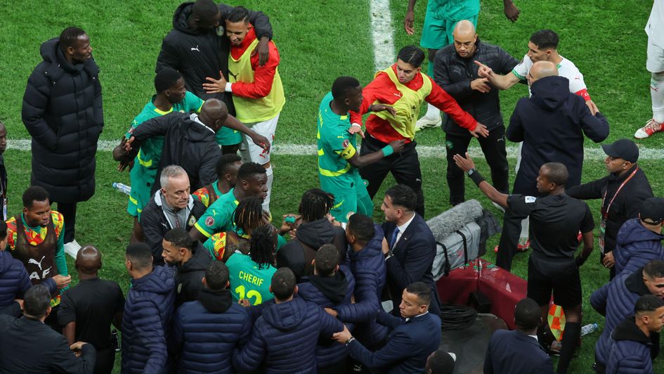 Players from both sides clash after a controversial penalty was awarded during the AFCON final