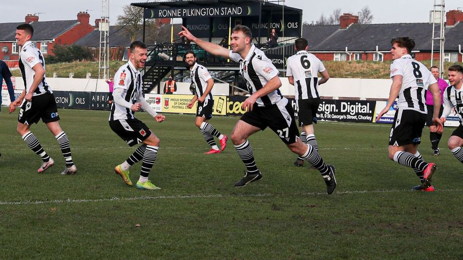 Chorley's players celebrate knocking Derby out of the FA Cup
