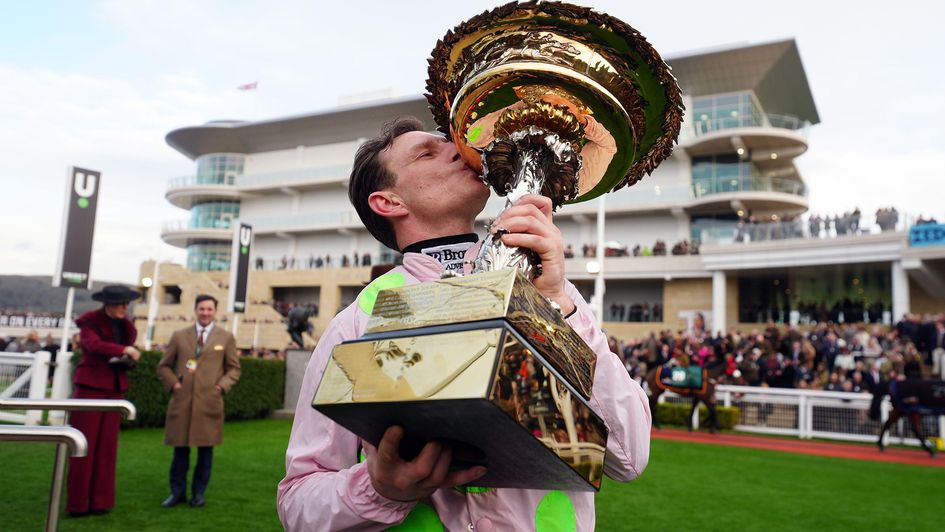 Paul Townend celebrates with the Champion Hurdle trophy