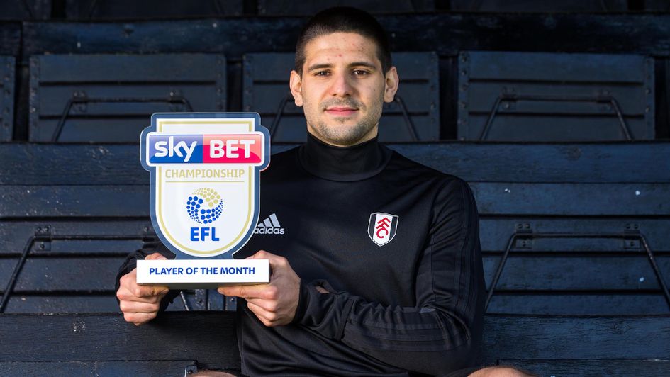 Aleksandar Mitrovic collects his Player of the Month award