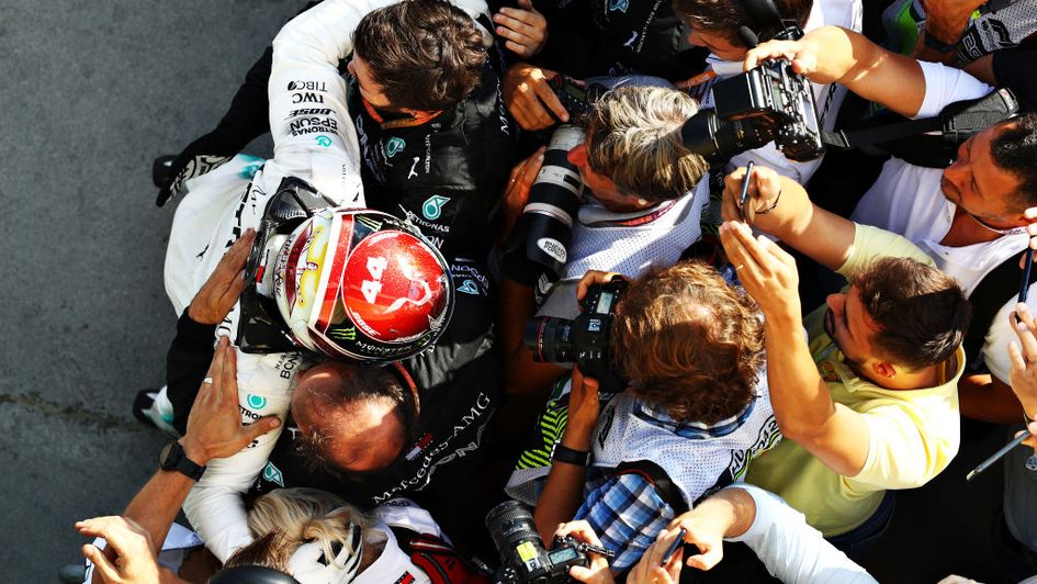 Hamilton celebrates with his team