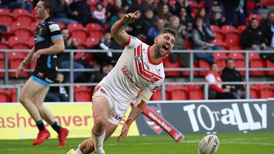 Tommy Makinson celebrates a try for St Helens