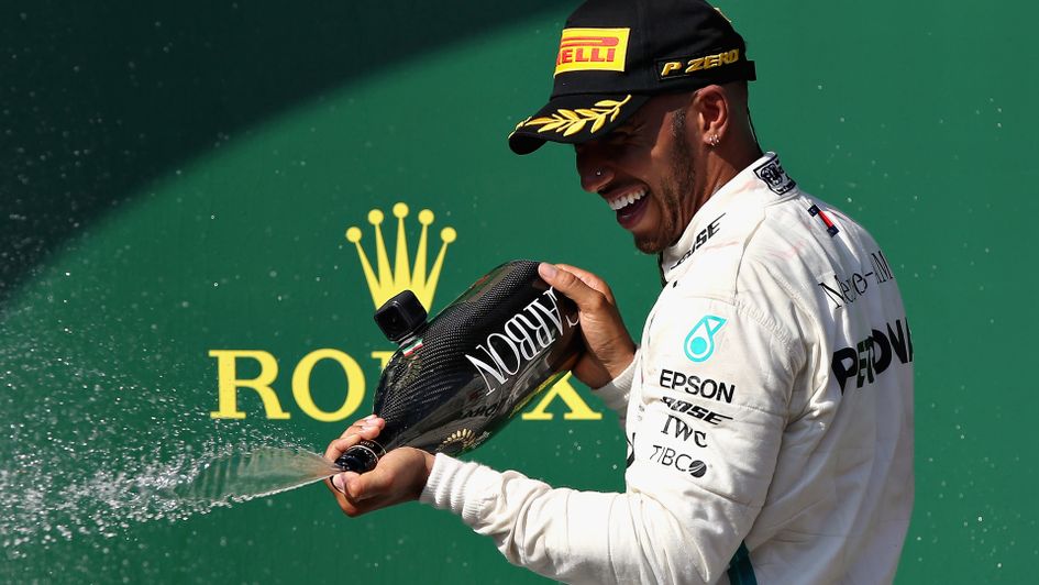 Lewis Hamilton celebrates after winning in Hungary