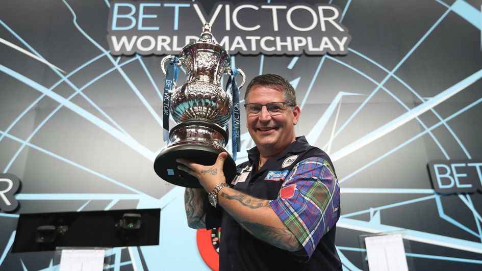 Gary Anderson celebrates with Phil Taylor Trophy after winning the World Matchplay (Picture: PDC/Lawrence Lustig)