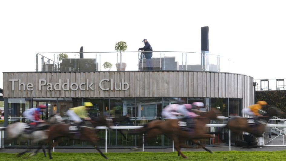 Runners pass an empty stand at Chester