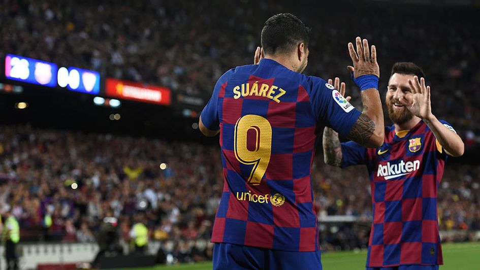 Luis Suarez and Lionel Messi celebrate for Barcelona
