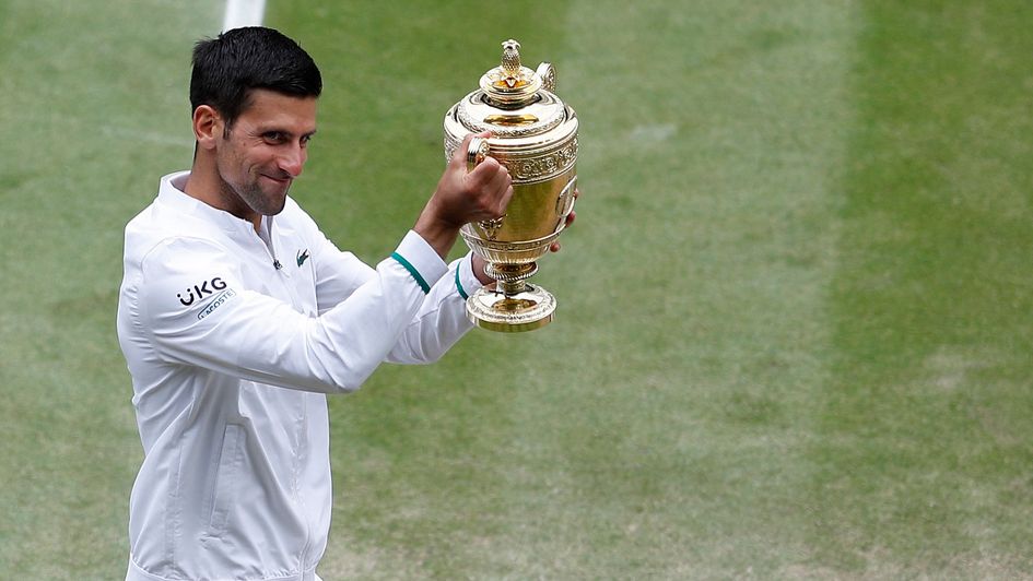 Novak Djokovic lifts the Wimbledon trophy