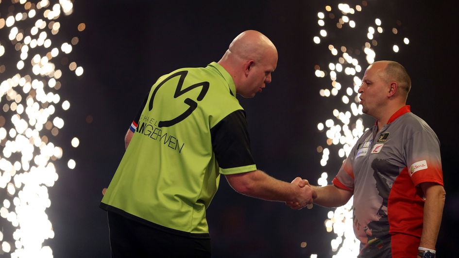 Michael van Gerwen shakes the hand of Darius Labanauskas