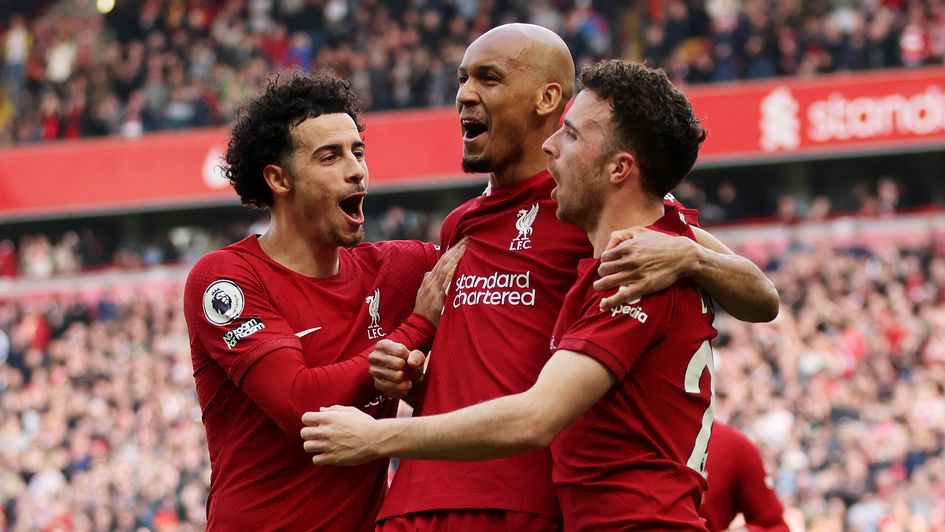 Fabinho celebrates a goal alongside Curtis Jones and Diogo Jota