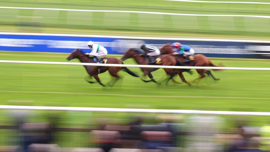 Enoch, ridden by Robert Havlin, on his way to victory at Newmarket