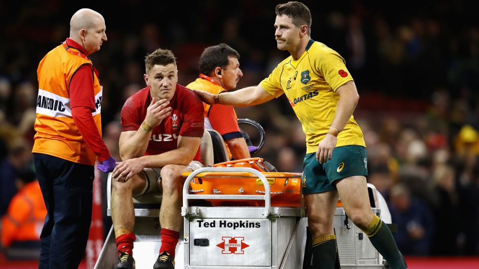 Jonathan Davies is carried from the field on Saturday