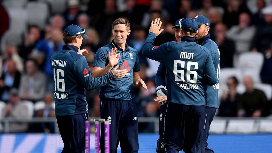 Chris Woakes and his England team-mates celebrate
