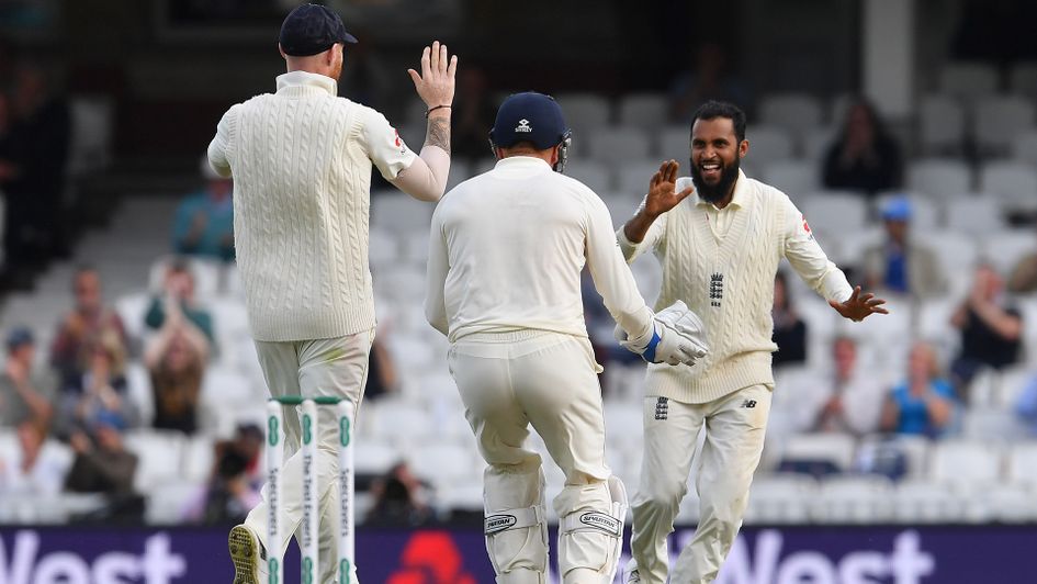 Adil Rashid (right) celebrates with Keaton Jennings and Jonny Bairstow