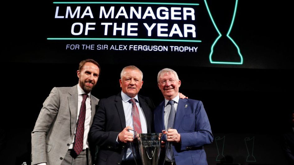 Chris Wilder is presented with his award by Sir Alex Ferguson and Gareth Southgate