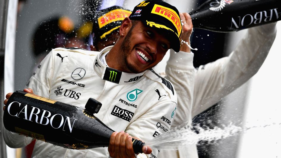 Lewis Hamilton celebrates his Silverstone success