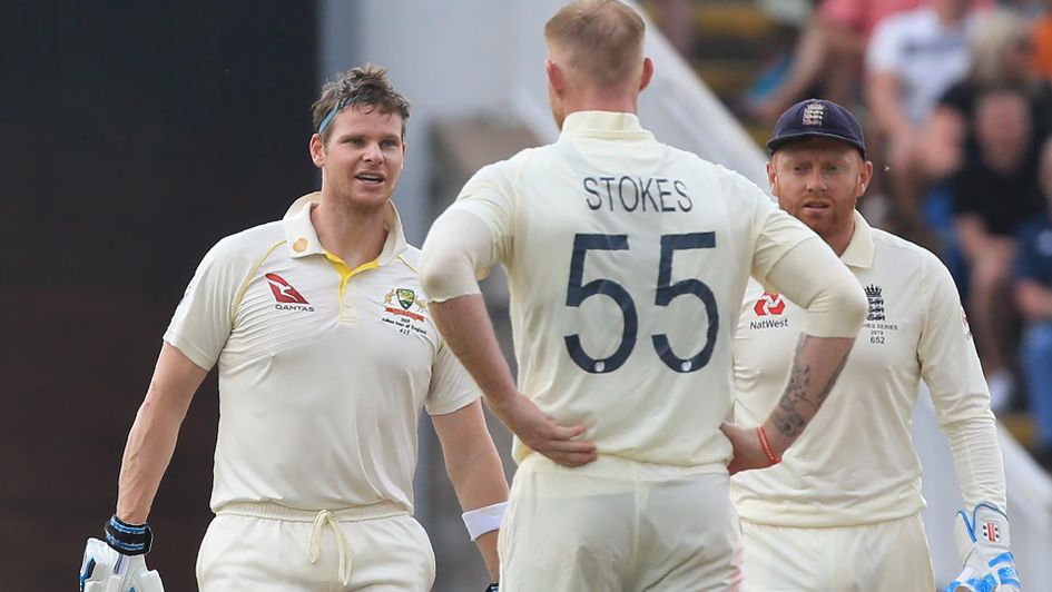 Australia's Steve Smith (left) reacts after being struck by the ball from England's Ben Stokes