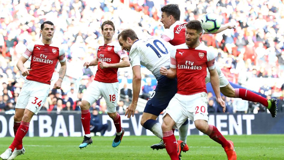 Harry Kane goes down under pressure from Shkodran Mustafi to win a penalty