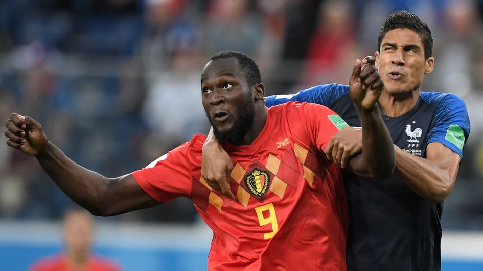 Romelu Lukaku and Rafa Varane battle