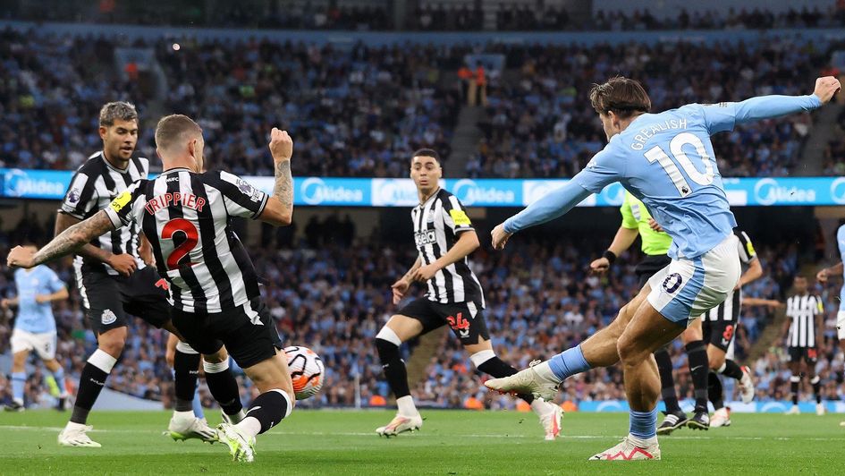 Manchester City's Jack Grealish has a shot against Newcastle
