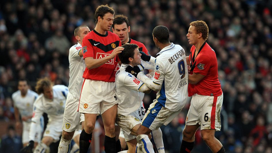 Manchester United and Leeds players grapple at Old Trafford in 2010