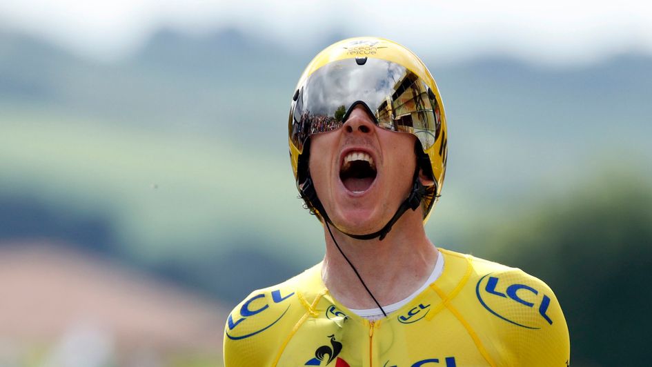 Geraint Thomas crosses the line to all but complete his Tour de France victory