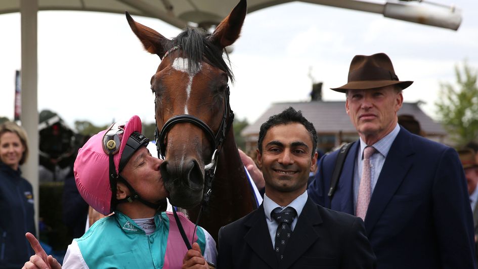 There's a kiss for Enable from Frankie Dettori as John Gosden looks on