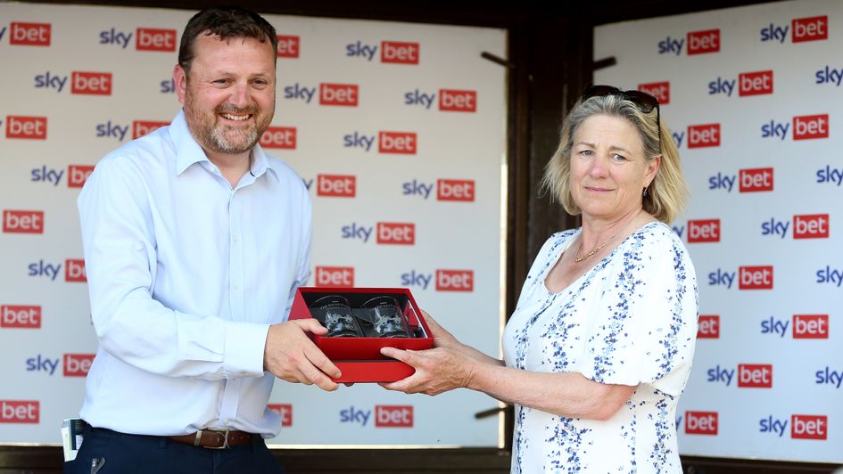 Maureen Haggas receives the winning trophy