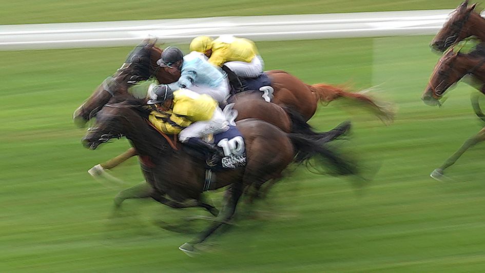 Power Of Darkness swoops on the outside at Ascot