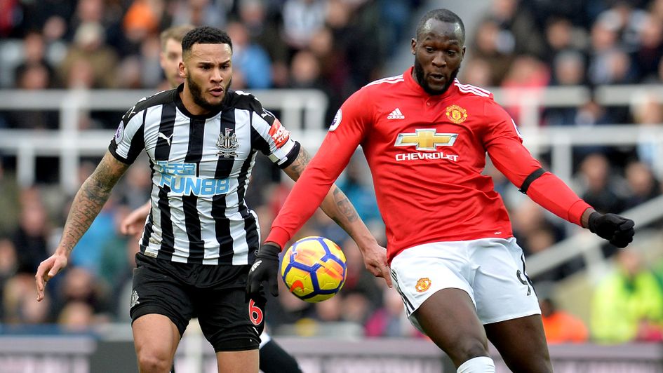 Jamaal Lascelles keeps track of Romelu Lukaku