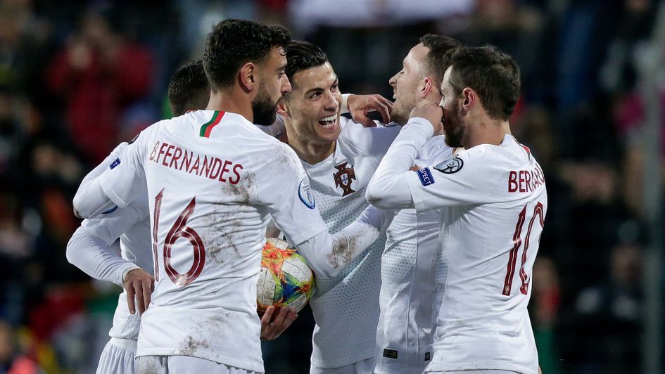 Cristiano Ronaldo celebrates with his Portugal team-mates