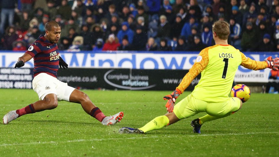 Salomon Rondon slots home Newcastle's opening goal against Huddersfield