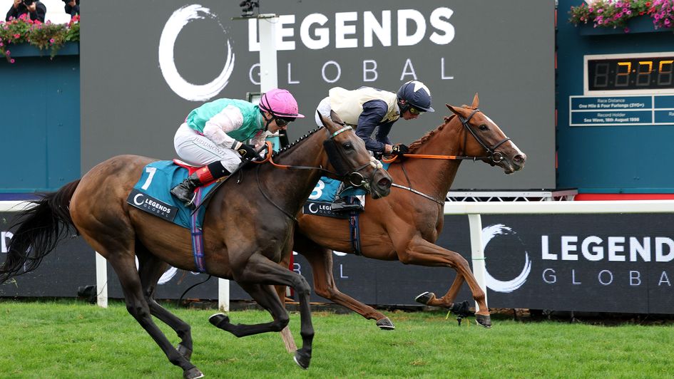 Kalpana (nearside) winning the Yorkshire Oaks by a narrow margin