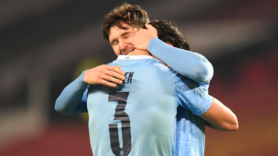 Manchester City's defensive duo John Stones and Ruben Dias