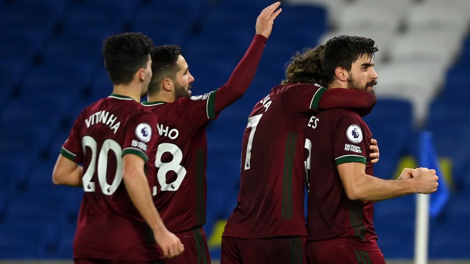 Ruben Neves celebrates scoring his penalty against Brighton