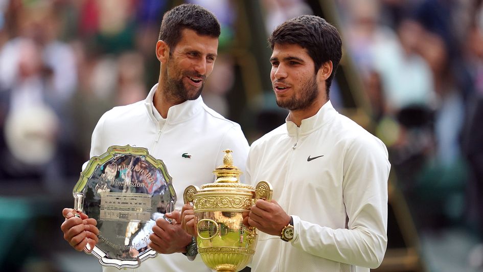 Carlos Alcaraz alongside Novak Djokovic after winning Wimbledon