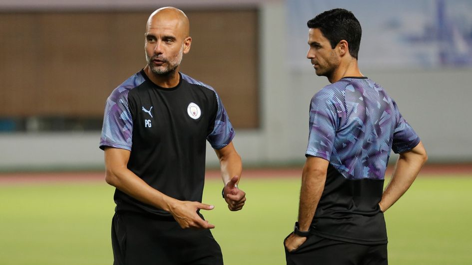 Pep Guardiola and Mikel Arteta watch Manchester City in training