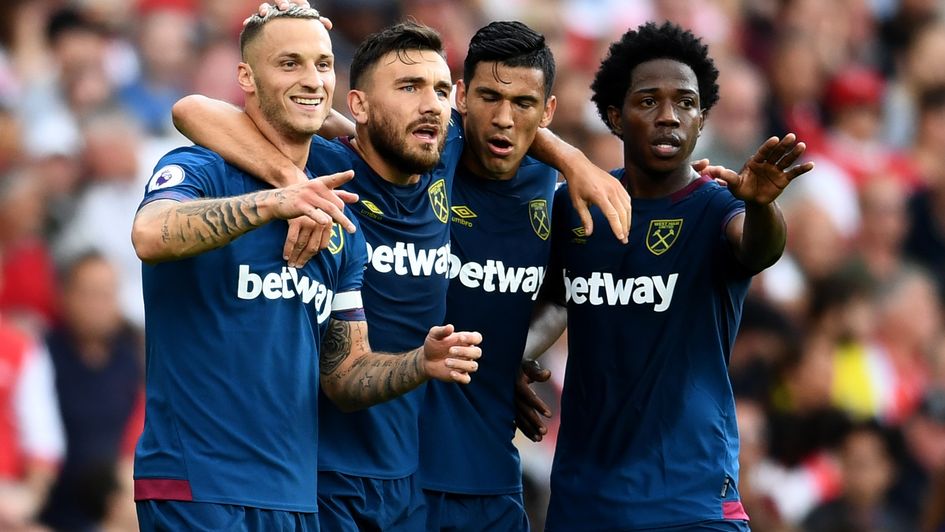West Ham players celebrate Marko Arnautovic's (left) goal against Arsenal
