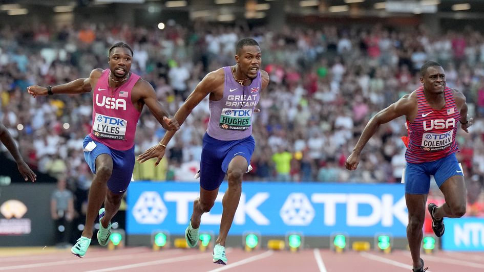 Hughes (centre) was delighted to achieve his goal and bag a medal