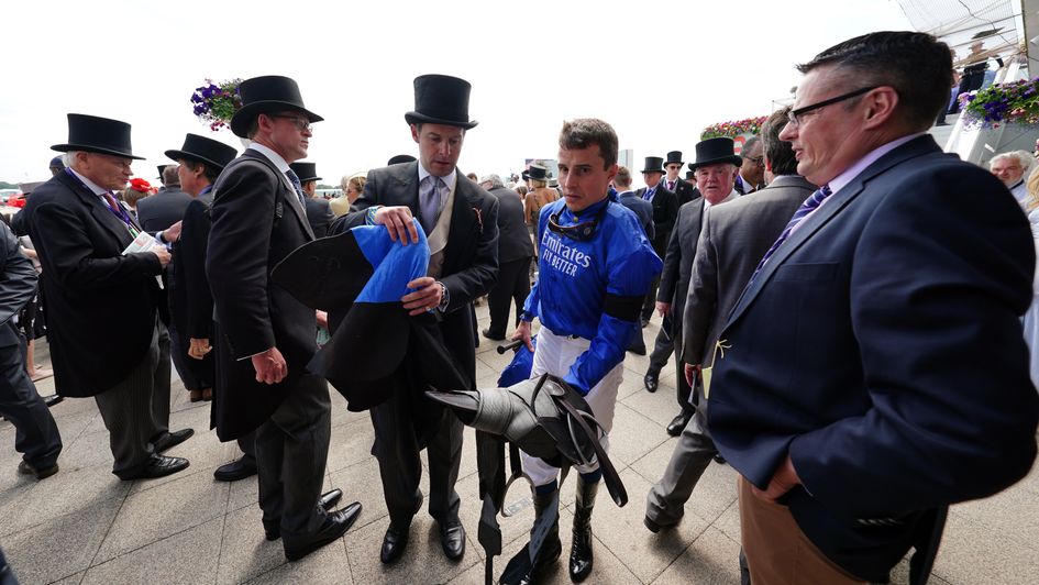 William Buick walks in after being left in the stalls at the first