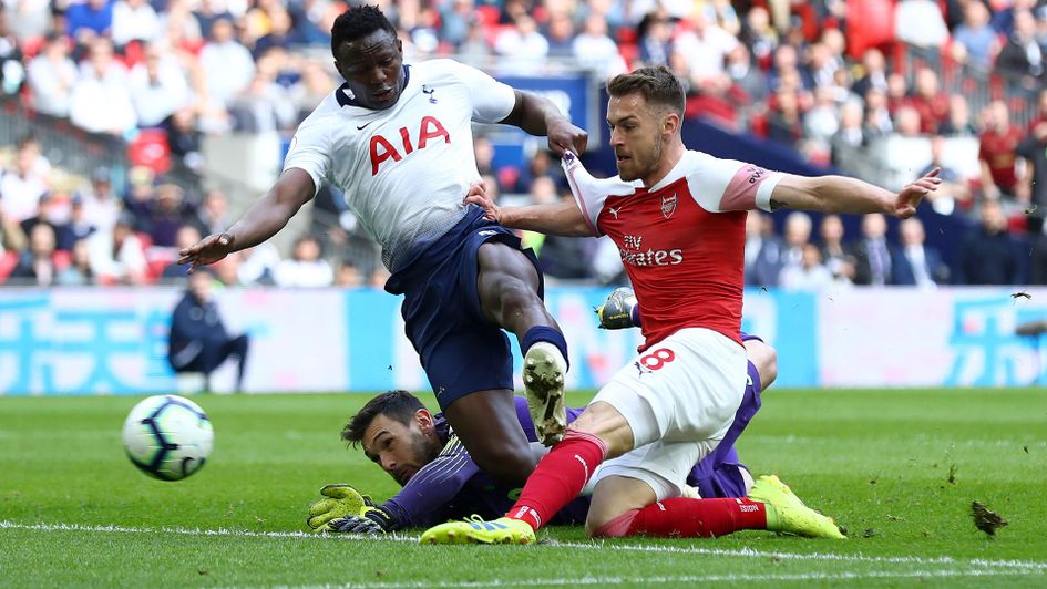 Aaron Ramsey slots home despite pressure from the Spurs defence