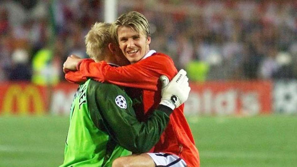 Peter Schmeichel and David Beckham embrace