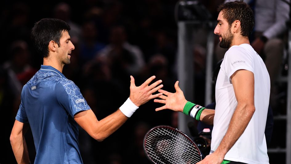 No stopping Novak: Marin Cilic shakes hands with Novak Djokovic at the Paris Masters