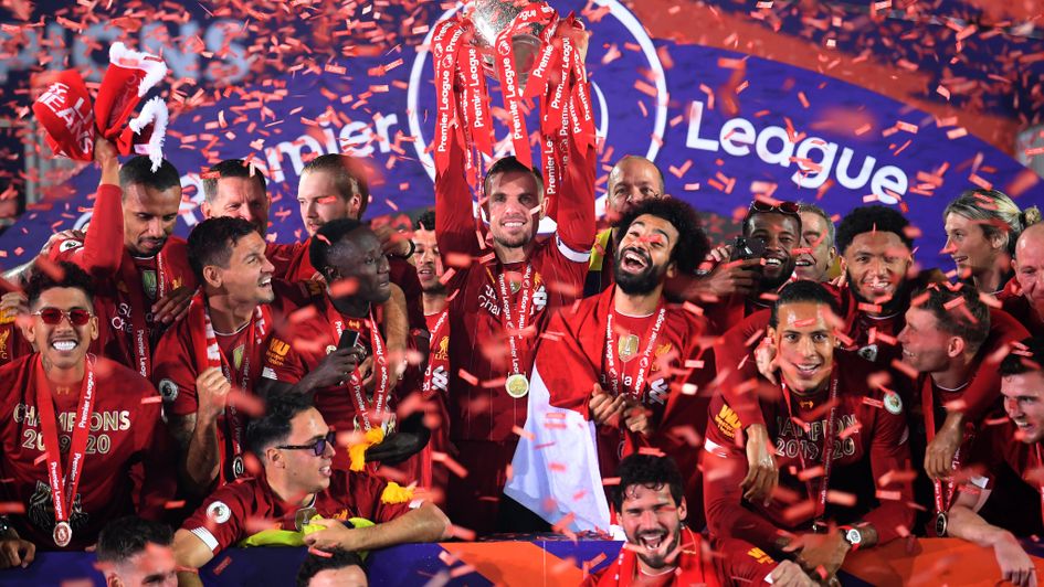Liverpool captain Jordan Henderson celebrates with Premier League trophy