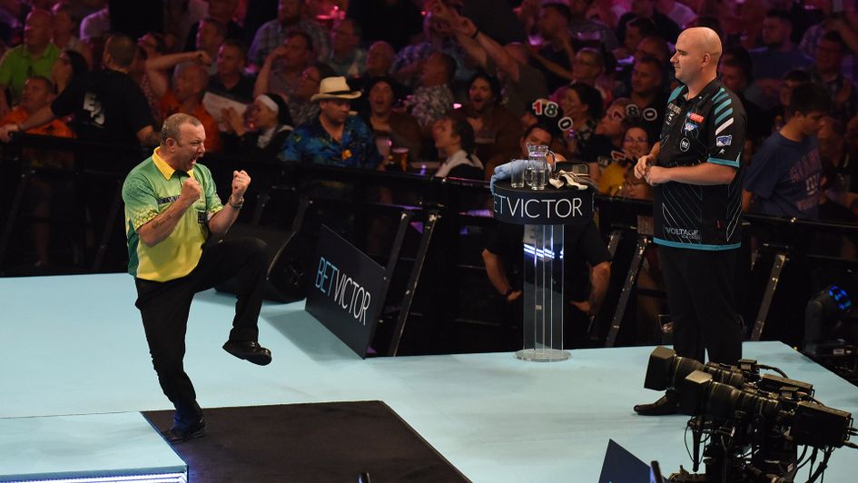 Darren Webster celebrates his shock victory over Rob Cross (Picture: Lawrence Lustig/PDC)