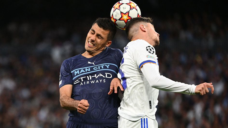 Rodri and Federico Valverde battle for the ball